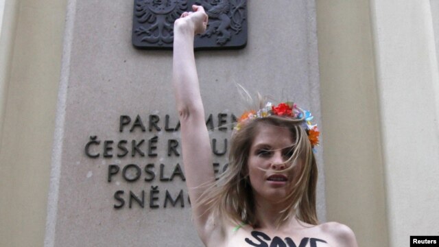 In what she describes as a "cry of despair," Hagen protested topless in front of the Czech parliament building earlier this month.