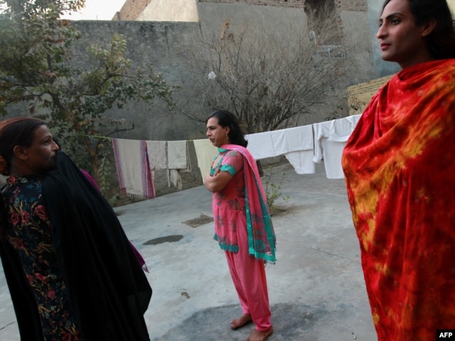 Pakistani hijras stand in the courtyard of their joint house in Rawalpindi.