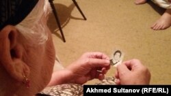 "Only the thought that we will be together after I die brings me solace," says Zura Batayeva, gazing at a picture of her son.