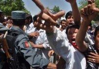 Afghans protest Iran's mass refugee expulsions in front of Tehran's embassy in Kabul on May 1 (AFP)