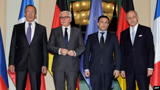 Russian Foreign Minister Sergei Lavrov, German Foreign Minister Frank-Walter Steinmeier, Ukrainian Foreign Minister Pavlo Klimkin and France's Foreign Minister Laurent Fabius ahead of their meeting in Berlin.