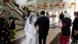 Newlyweds arrive at a civil marriage-registration office in Dushanbe.