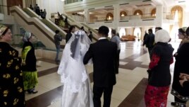Newlyweds arrive at a civil marriage-registration office in Dushanbe.