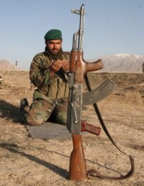 An Afghan soldier prays outside the Pul-e Charkhi prison, 27 February (epa)
