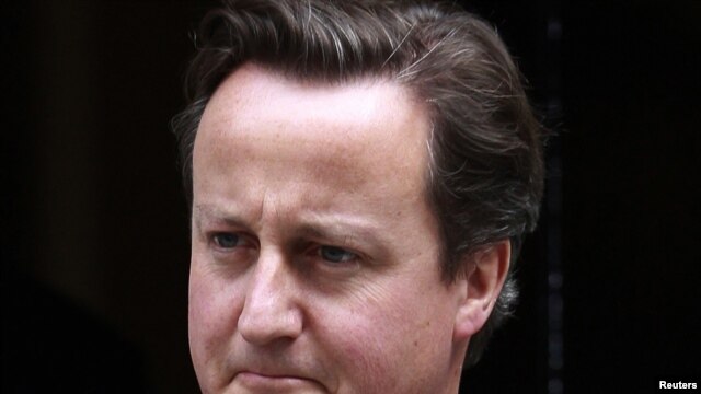 Britain's Prime Minister David Cameron leaves 10 Downing Street in London to appear before Parliament on July 20.