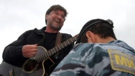 Russian rock singer Yury Shevchuk performs at a protest rally in central Moscow.