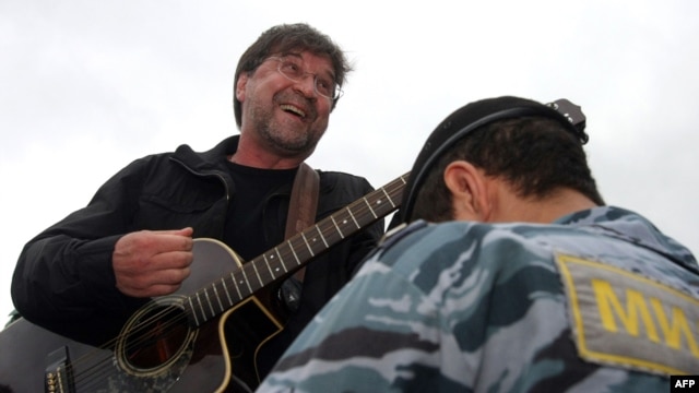 Russian rock singer Yury Shevchuk performs at a protest rally in central Moscow.