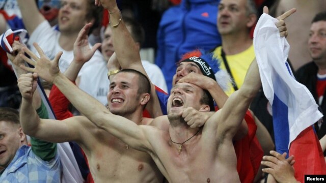Russian soccer fans celebrating during their country's 4-1 win over the Czech Republic in Wroclaw, Poland. 