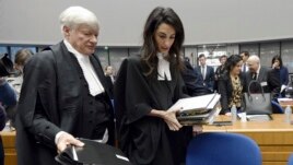 France -- Lawyers representing Armenia, Amal Clooney (R) and Geoffrey Robertson, arrive for the start of the appeal hearing in Perincek case before the European Court of Human Rights in Strasbourg, January 28, 2015