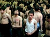Believers flail themselves during Ashura, as these Iranians are doing on a previous Ashura (file photo) (kosoof.com)