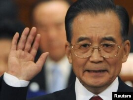 Prime Minister Wen Jiabao delivers a speech during the opening ceremony of the National People's Congress in Beijing