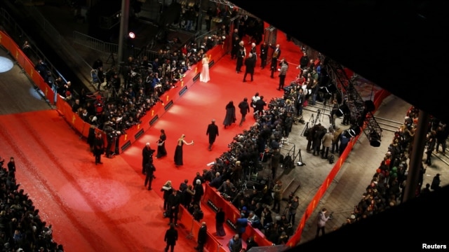 People arrive on the red carpet for the screening of "The Grandmaster" at the Berlinale on February 7.