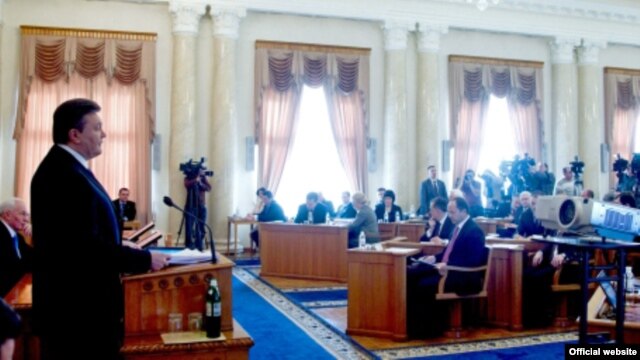 Ukrainian President Viktor Yanukovych (left) speaks during a televised cabinet meeting in Kyiv on March 7.