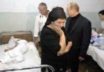 Vladimir Putin in Beslan after the massacre last year