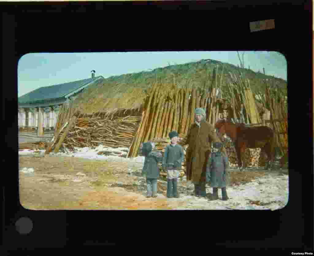 John Wells Rahill and three Russian boys in a small village