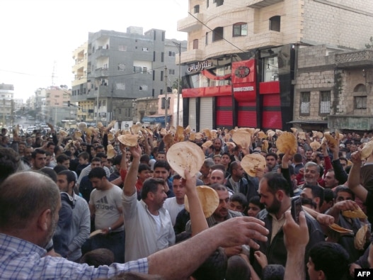 Antigovernment protesters in the Syrian port city of Banias