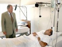 Lebanese President Emile Lahoud visiting a wounded Lebanese soldier near Beirut on July 18 (epa)