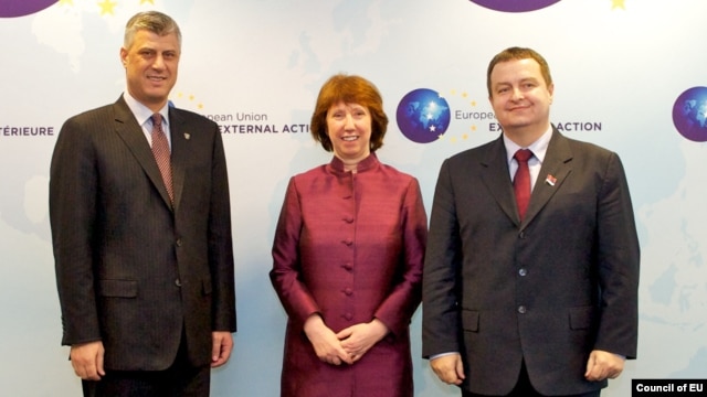 European Union foreign-policy chief Catherine Ashton met on February 19 with Kosovo's Hashim Thaci (left) and Serbia's Ivica Dacic (right).