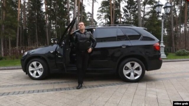 Russian Prime Minister Dmitry Medvedev steps out of a BMW SUV in a video posted on his blog. As one commentator noted, all it needed was a gangster-film soundtrack.