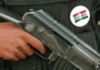 An Iraqi private security officer in Al-Basrah wearing an 'Elect Iraq' badge on his body armor
