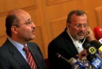 Iranian Foreign Minister Manuchehr Mottaki (right) listens to Iraqi Deputy Prime Minister Barham Salih during a press conference in Tehran in September (epa)