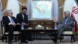 Top nuclear negotiator Saeed Jalili speaks with Sergei Ryabkov, Russia's representative in international talks with Iran, over its disputed nuclear program, during a meeting in Tehran on November 14.