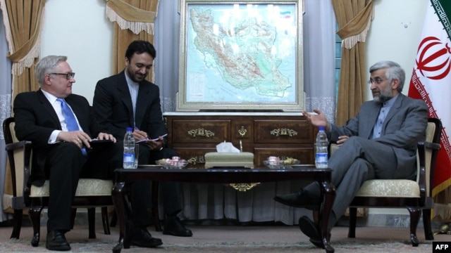 Top nuclear negotiator Saeed Jalili speaks with Sergei Ryabkov, Russia's representative in international talks with Iran, over its disputed nuclear program, during a meeting in Tehran on November 14.