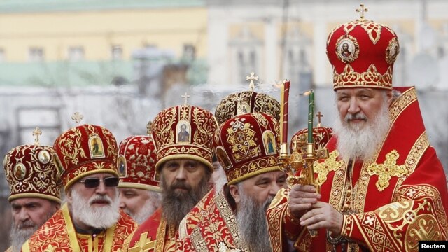Patriarch Kirill (right) leads a call to prayer in support of the Russian Orthodox Church at Christ the Savior Cathedral in Moscow.