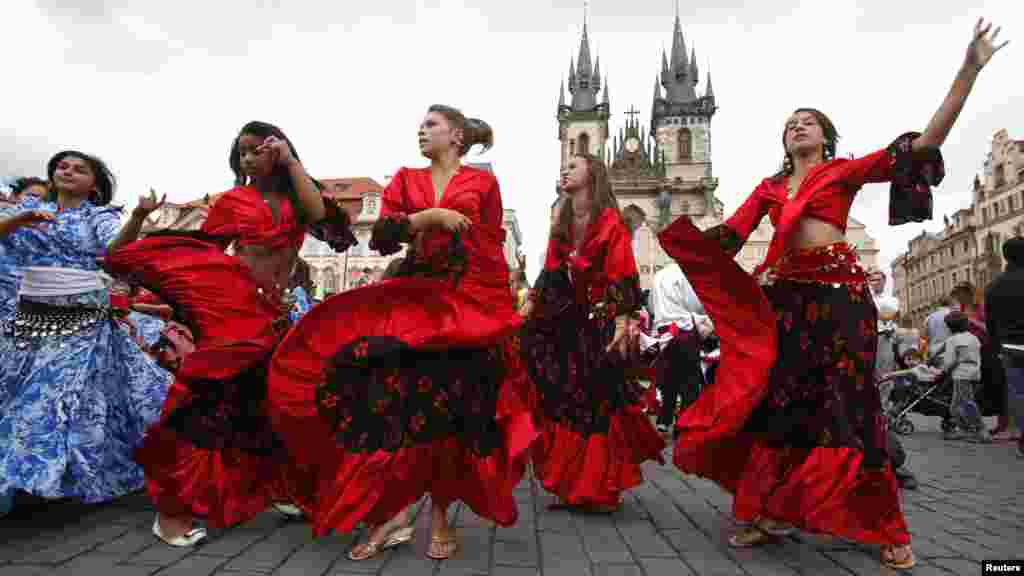 Participants in the Khamoro World Roma Festival dance through the historical centre of Prague on May 31.(Reuters/David W. Cerny)
