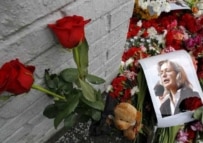 Flowers and a picture of Politkovskaya outside her home on October 8 (epa)