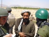 A local malik, or village administrator, shows where he wants a bridge to be built (RFE/RL)