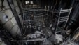 Russia -- The charred bunk beds stand inside a burned-out warehouse, the scene of a deadly fire at Kachalovsky construction market on the outskirts of Moscow, 03Apr2012