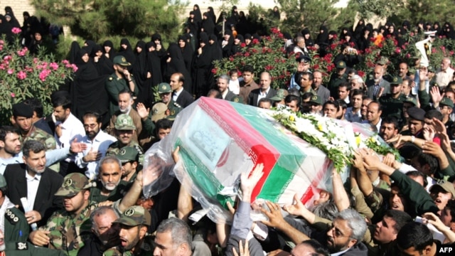 Iranians carry the coffin of General Nourali Shoushtari, one of the Revolutionary Guards commanders killed in the suicide attack claimed by Jundallah.