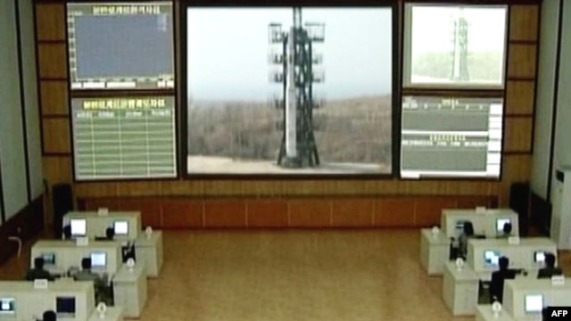 TV grab showing a control room where a three-stage white rocket bearing the word "Chosun" (Korea) appears at an unspecified launch site. (file photo)
