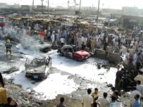 Two car bombs struck this market in Al-Qurnah on June 8 (epa)