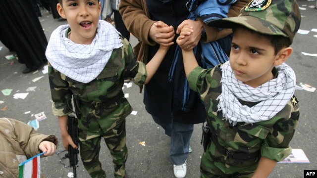 Children taking part in a rally marking the 30th anniversary of the Islamic Revolution in Tehran last year -- Iran's next generation of martyrs?