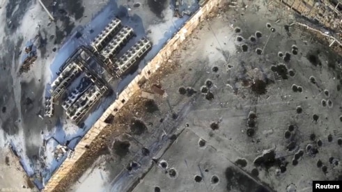 Aerial footage shot by a drone shows shell craters from intense fighting at Donetsk's international airport.