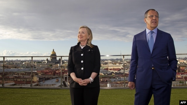 Russian Foreign Minister Sergei Lavrov (right) and U.S. Secretary of State Hillary, posing for photos in St. Petersburg back in June, say the new agreements are further proof of growing cooperation.