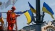 A municipal worker decorates a Kyiv street with Ukrainian national flags ahead of Day of the National Flag on August 23 and Independence Day on August 24.