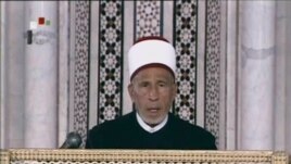 An image grab taken from state-run Syrian television on March 21 shows an archive video of senior cleric Muhammad al-Buti speaking during a religious ceremony at the historic Umayad Mosque in Damascus.