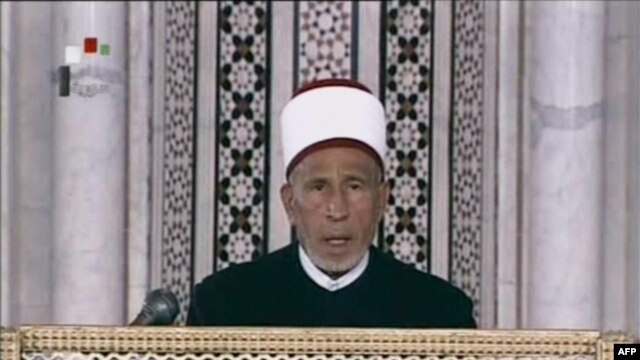 An image grab taken from state-run Syrian television on March 21 shows an archive video of senior cleric Muhammad al-Buti speaking during a religious ceremony at the historic Umayad Mosque in Damascus.