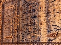 A pastel-colored carpet on display at Domotex (RFE/RL)