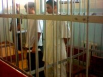 Former Guantanamo inmates Muqit Vohidov and Rukniddin Sharopov in a Dushanbe court during their trial (RFE/RL)
