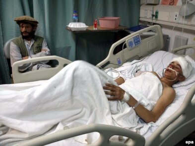 An Afghan boy injured in the rocket attack of 16 November lies in a hospital bed at a U.S. military base north of Kabul on November 17.