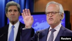 The new U.S. Mideast peace envoy Martin Indyk (right) speaks to the media next to U.S. Secretary of State John Kerry at the State Department in Washington on July 29.