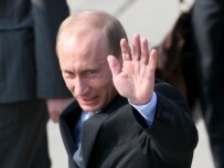 Russian President Vladimir Putin waves as he arrives at Rostock-Laage airport today (epa)
