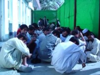 Afghan traders waiting to enter ISAF's compound in Kabul (RFE/RL)