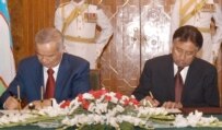 Presidents Karimov (left) and Musharraf at a signing on May 2 (epa)