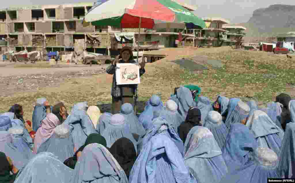 Female students attend an outdoor lesson.