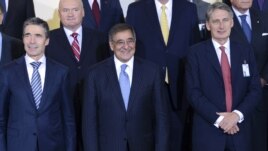 NATO Secretary General Anders Fogh Rasmussen, US Defense Secretary Leon Panetta and Britain's Secretary of Defense Philip Hammond pose for a  photo at the NATO Defense Ministers meeting at the NATO headquarter in Brussels